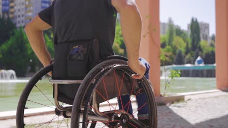 Man-sitting-in-wheelchair-in-slow-motion.